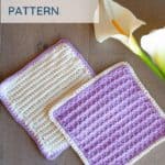 two crochet washcloths purple and white