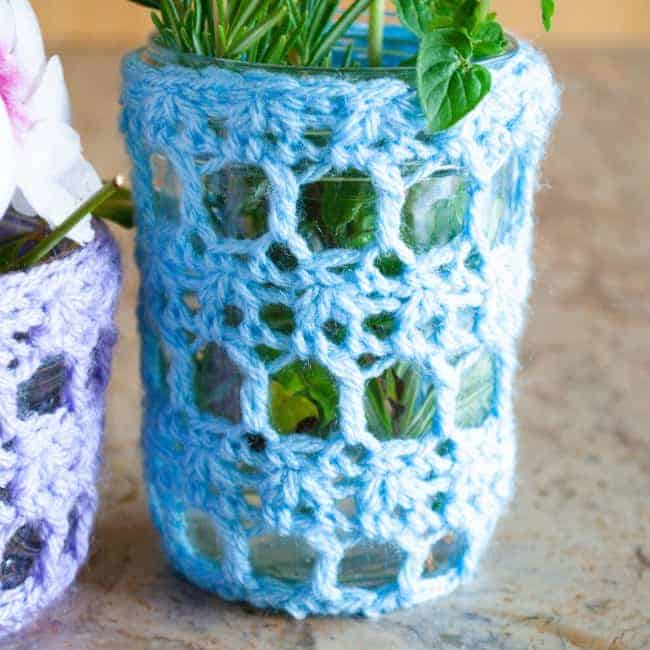 close up of light blue crochet mason jar cover