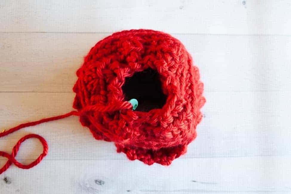 top of crochet hat with hole partially closed