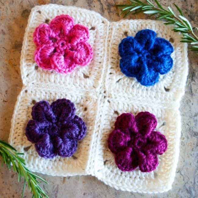 crochet flowers square with four flowers and greenery