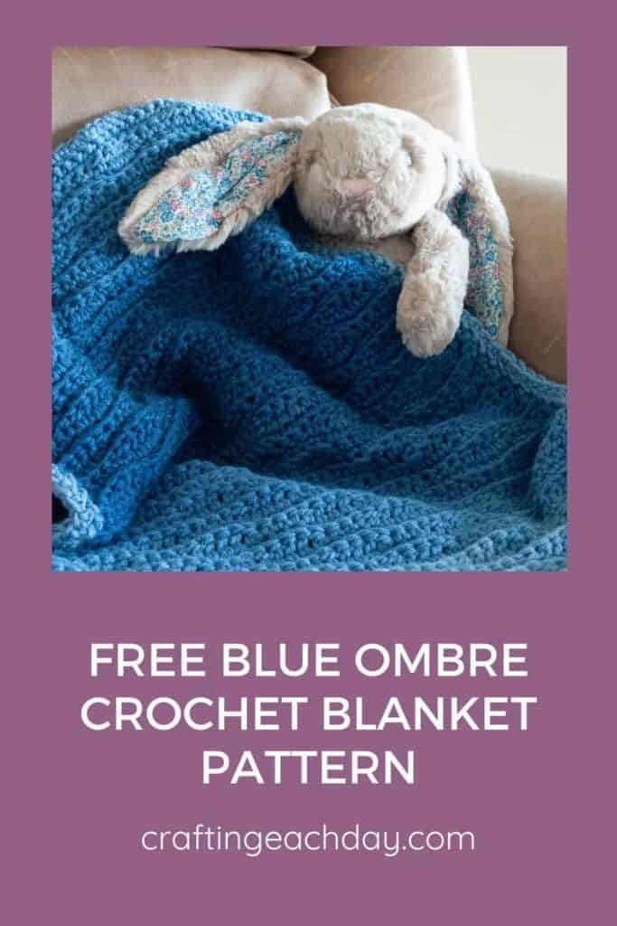 stuffed rabbit holding blue crochet blanket and text reading free blue ombre crochet blanket pattern