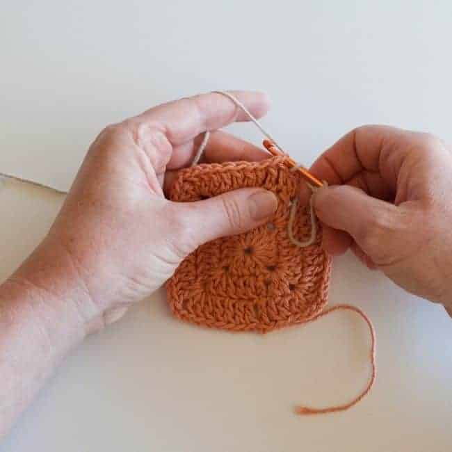 inserting hook into spot where stitch will be made