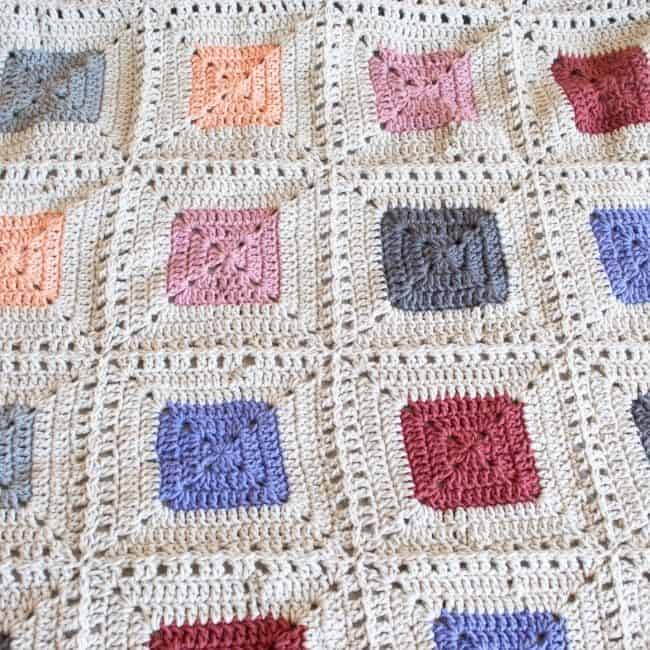 close up of some of the squares in the scrap yarn blanket