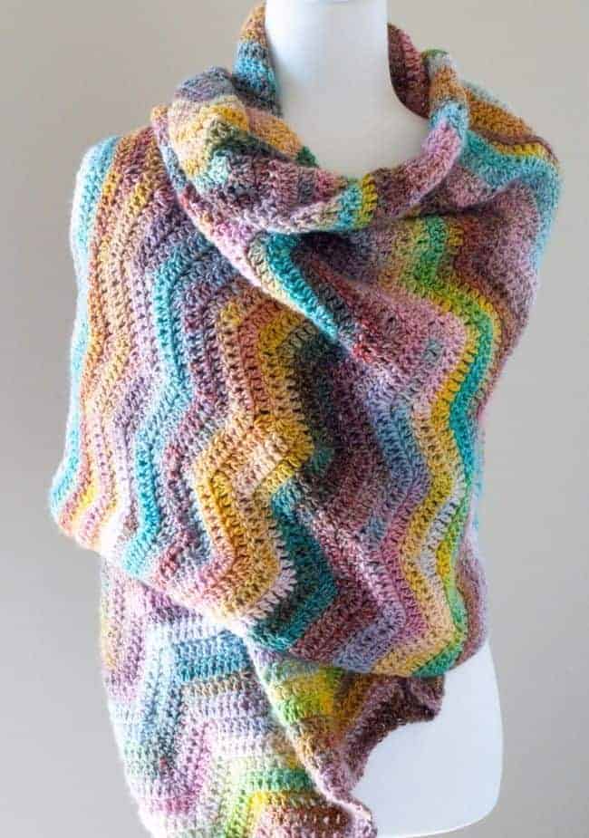 ripple crochet shawl wrapped around a manequin