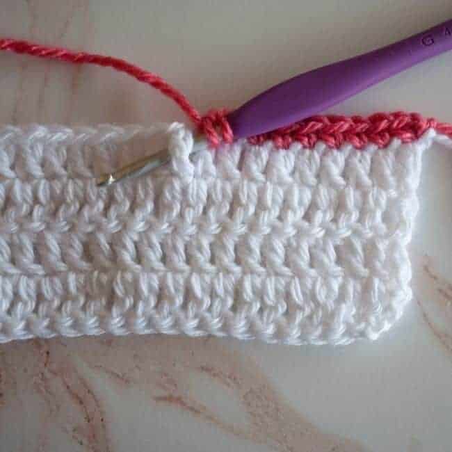 crochet hook is inserted around the post of the indicated stitch