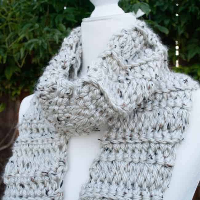 chunky scarf wrapped around neck of a mannequin