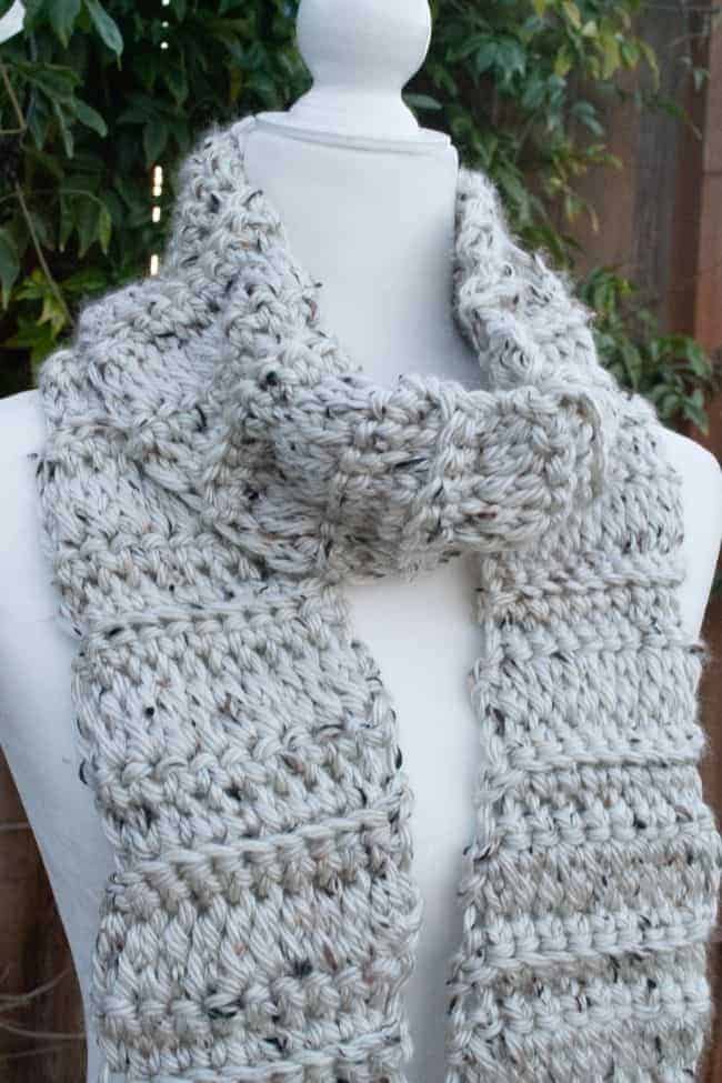 chunky crochet scarf wrapped around mannequin