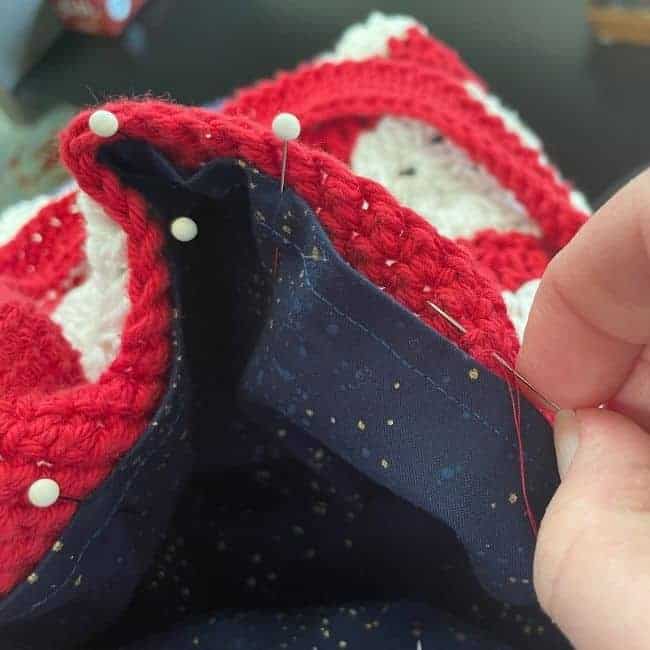 close up of hand sewing