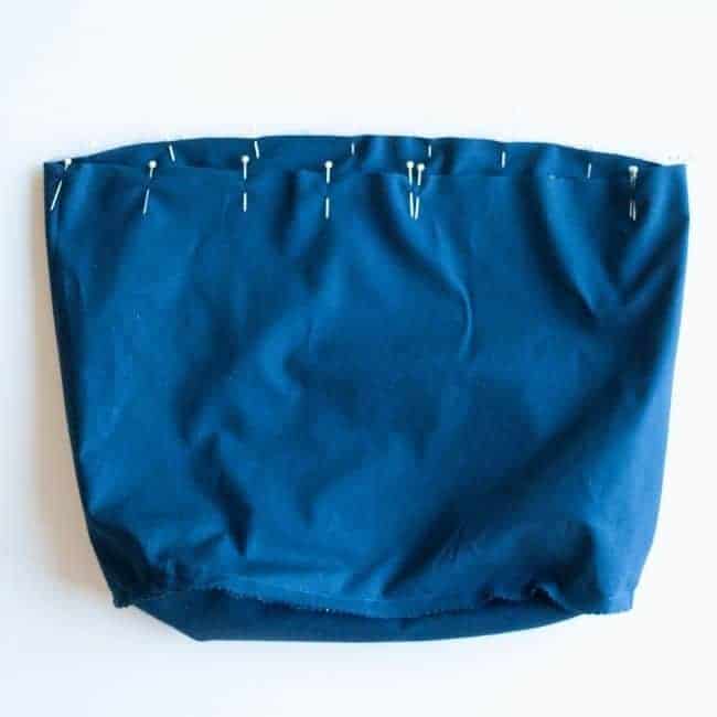 bag lining layers are lined up and inserted in each other and pinned leaving an opening