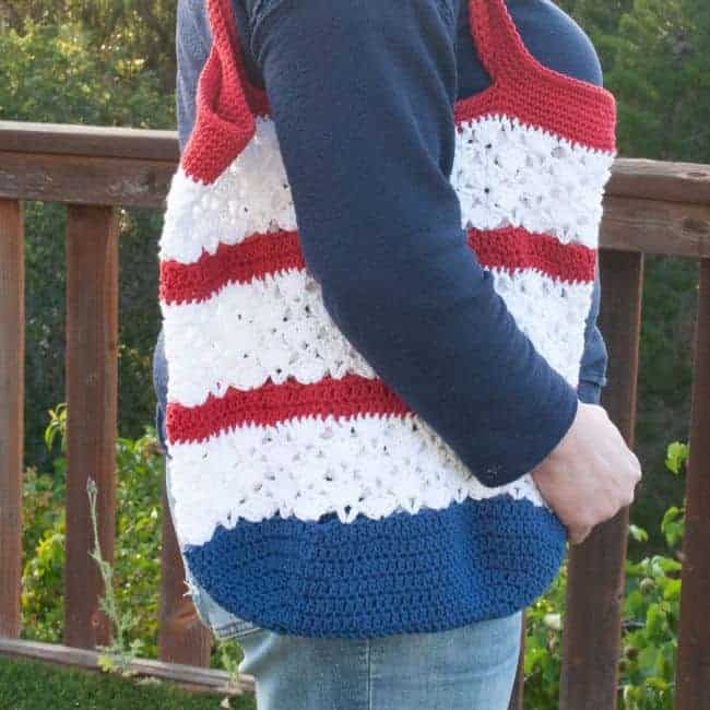crochet market bag worn over the shoulder