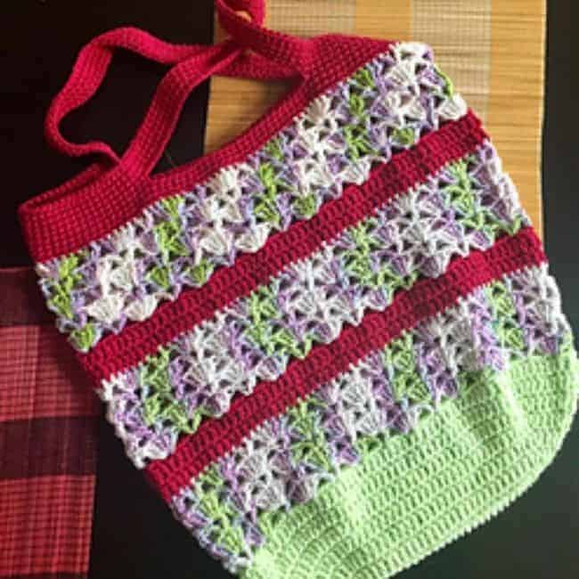 crochet market bag with red stripes laying flat