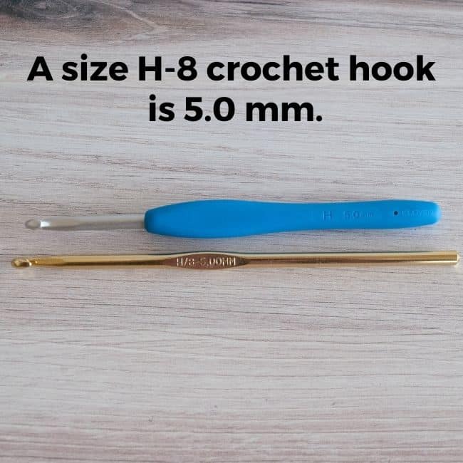 Two H-8 crochet hooks next to each other and text reading A size H-8 crochet hook is 5.0 mm