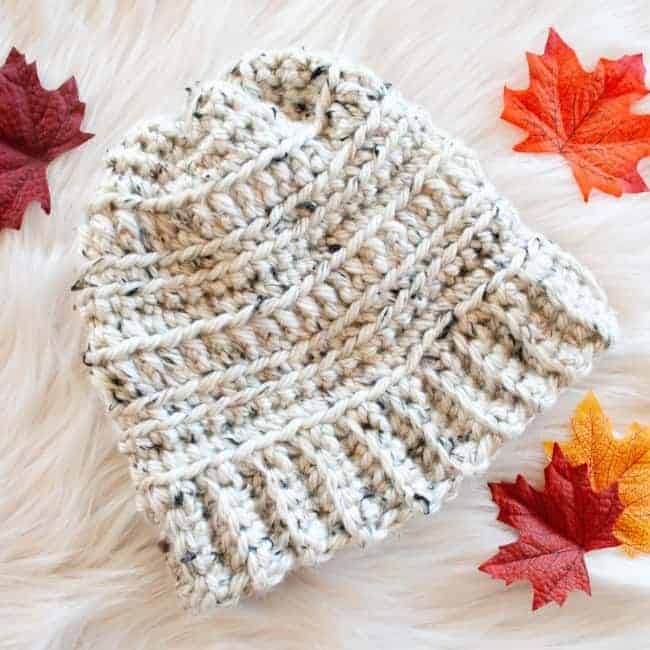 close up of medium super bulky crochet hat and leaves