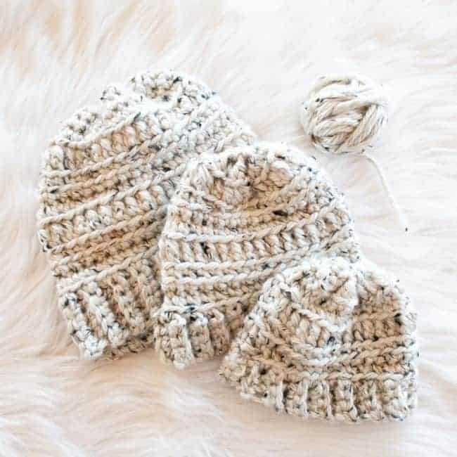 super bulky crochet hats in three sizes with small ball of yarn