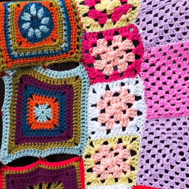 collection of assorted crocheted squares some of them joined together.