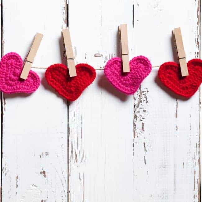 crocheted hearts held by clothespins