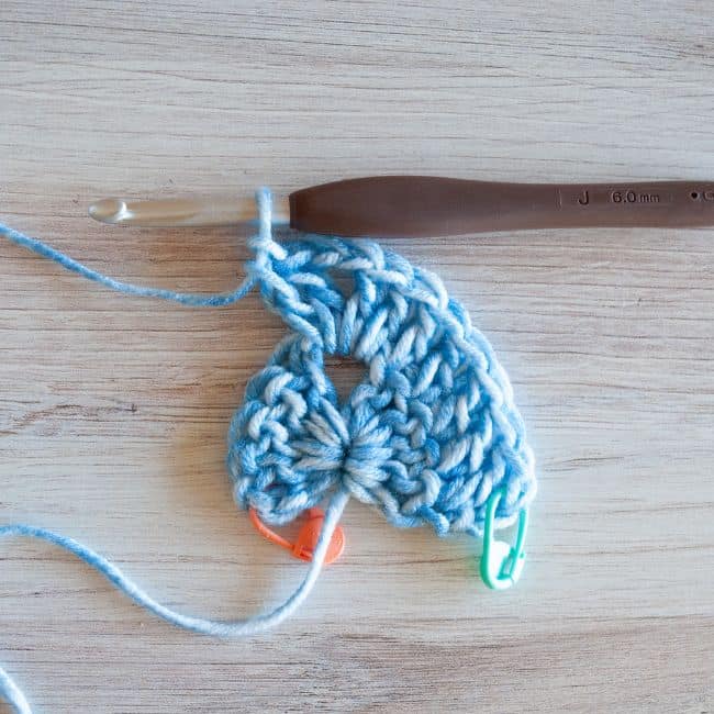 showing two double crochet stitches, chain two, and two double crochet stitches in the center chain two space
