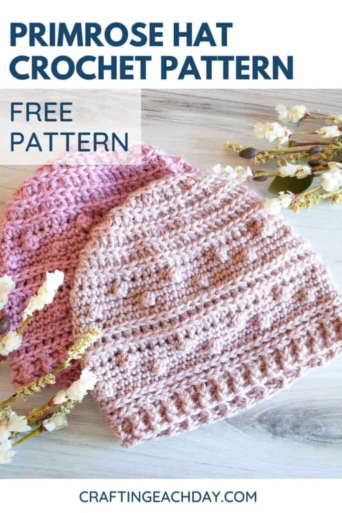 text reading primrose hat crochet pattern free pattern and two pink crochet hats with white and green foliage