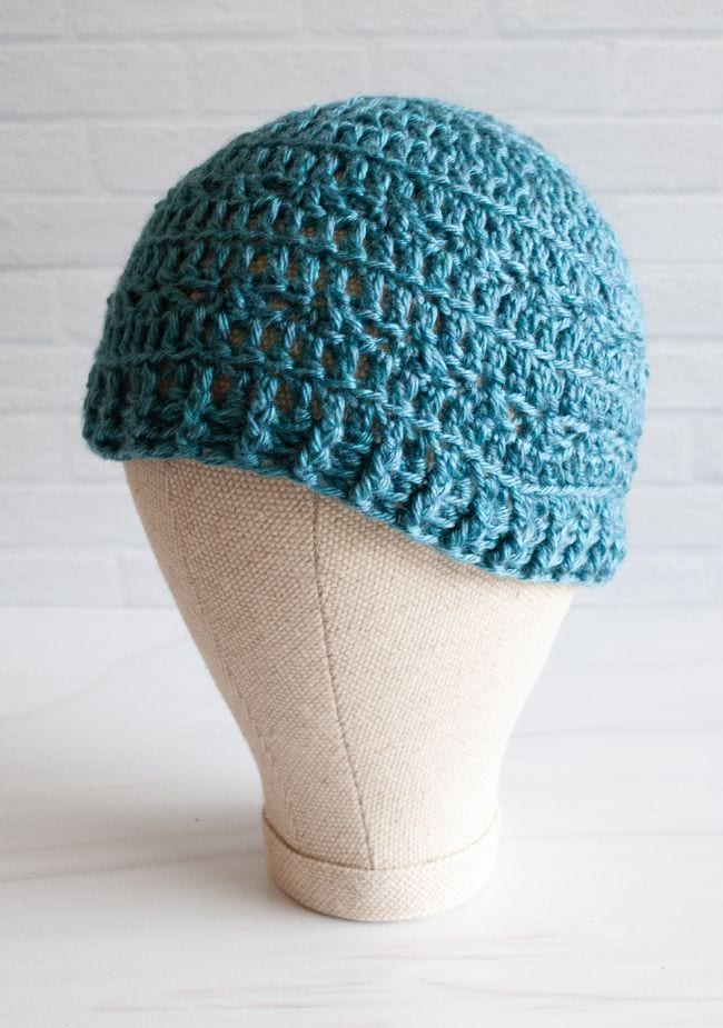 mannequin head with teal crochet beanie